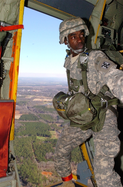 Army Sgt. 1st Class Larry Carter, a jump master with the Army Reserve�s 421st Quartermaster Company, 143rd Sustainment Command, prepares to jump out of an Air Force C-130 during an Employer Support of the Guard and Reserve �Boss-lift� event Jan. 9, 2009, in Fort Valley, Ga. U.S. Army photo by Spc. Ian Morales  