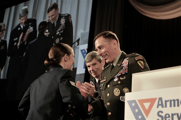 U.S. Air Force Staff Sgt. Stephanie Cates receives the Angels of the Battlefield Award from U.S. Army Gen. David Petraeus, commander, U.S. Central Command, and U.S. Air Force Chief of Staff Gen. Norton A. Schwartz, during a dinner in honor of military medics and corpsman at the Ronald Reagan Building in Washington, D.C., March 11, 2009. U.S. Air Force photo by Tech. Sgt. Suzanne M. Day  