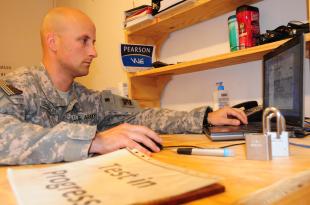Army Spc. Ryan Severson from Headquarters Company, 81st Brigade Combat Team, Washington Army National Guard, spends his off time working at the Camp Ramadi testing and education center. Severson and some of his friends and co-workers created the testing center after he discovered how few education resources were available on Camp Ramadi, Iraq. Sgt. Amanda Gauthier 