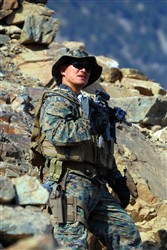 Navy Petty Officer 1st Class Reynaldo S. Datu patrols on a mountain in eastern Konar province, Afghanistan, with his Marine embedded training team and soldiers from 3rd Kandak (Armored), 3rd Brigade, 201st Afghan National Army Corps. Datu is part of Embedded Training Team 7-2, which is deployed from Okinawa, Japan, to work with the Afghan National Army. He is the only sailor based out of Forward Operating Base Naray, Afghanistan. Photo by Staff Sgt. Luis P. Valdespino Jr., USMC 